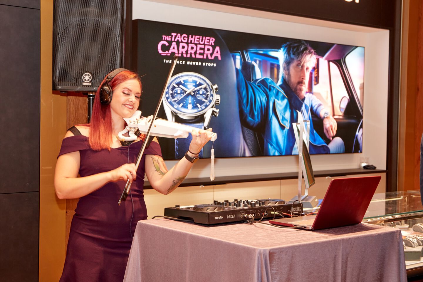 Musician Razzvio plays her electric violin during the grand opening ceremony. 